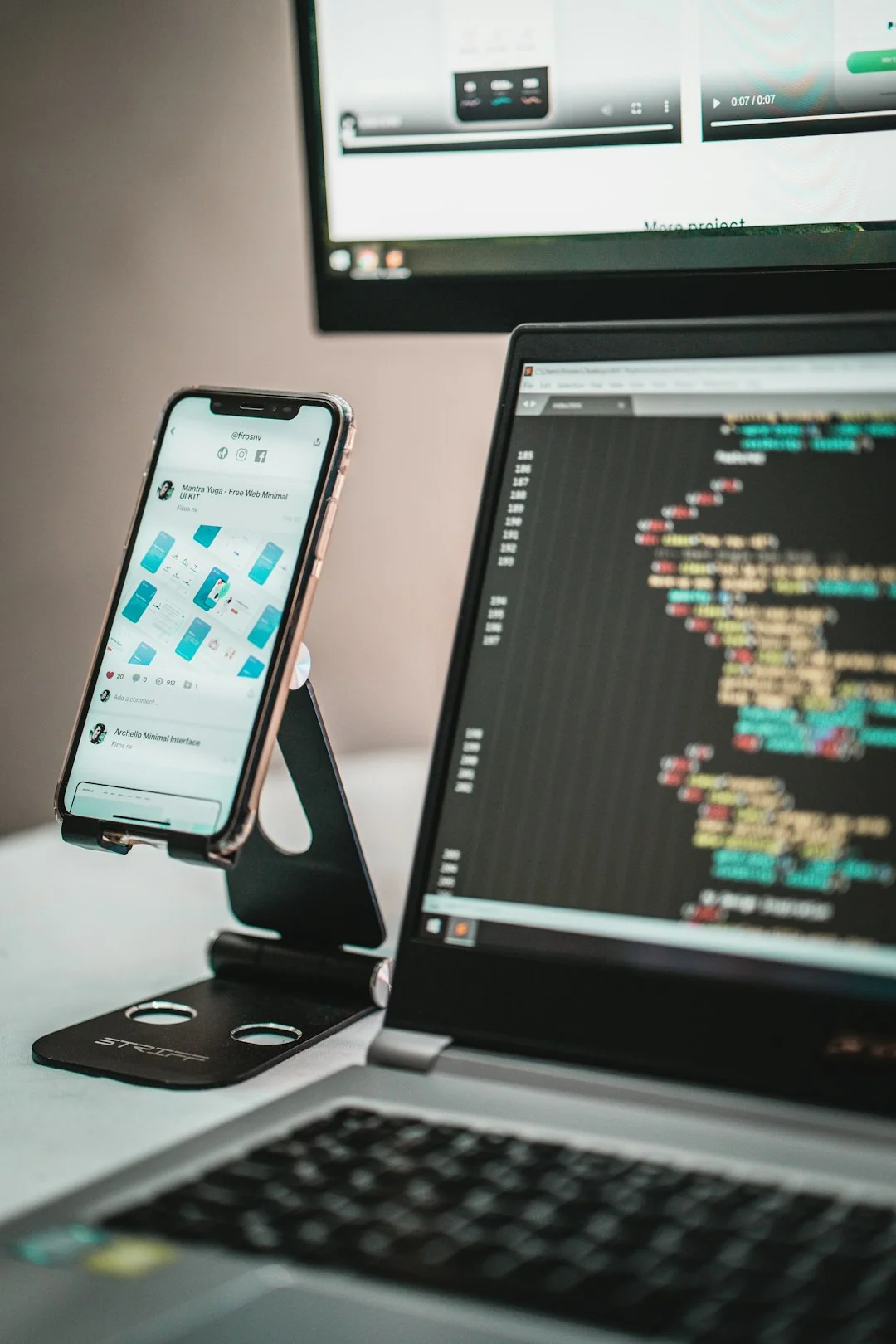 A contemporary workspace showcasing a laptop, tablet, and smartphones, ideal for tech and freelance use.